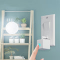 Close-up of white robot finger button-pushing mechanism