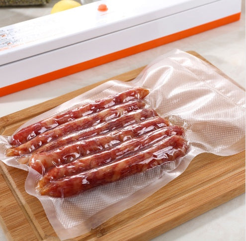 Vacuum sealing machine sealing a partially closed plastic food storage bag