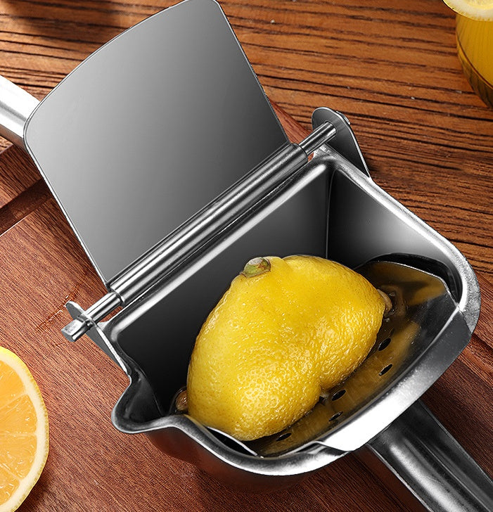 Side view of stainless steel citrus juicer with hand on handle