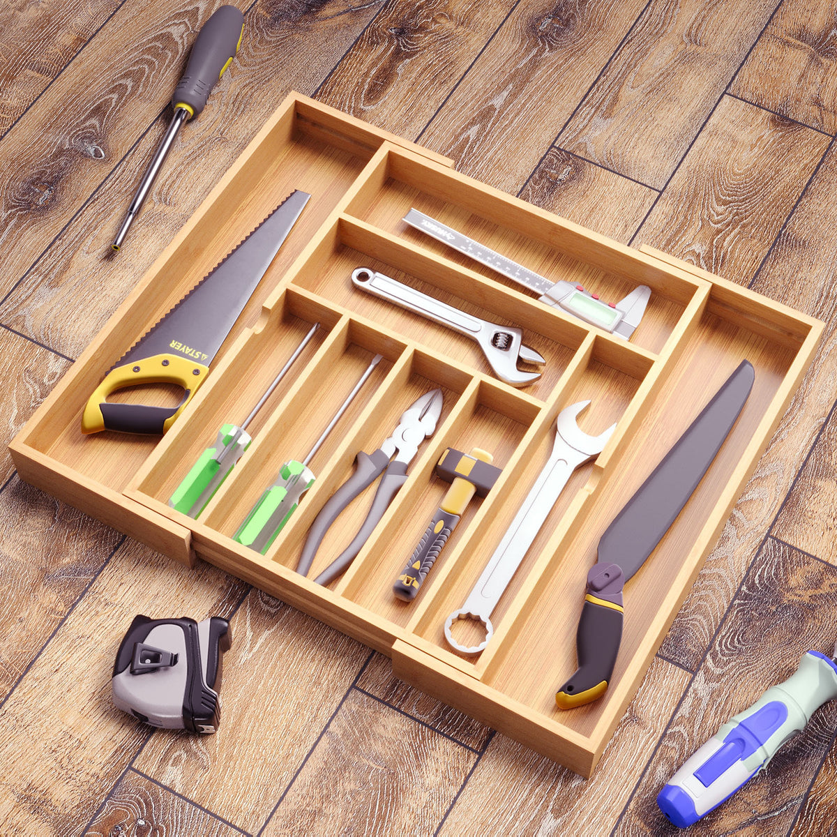 Bamboo drawer organizer with 5+2 compartments shown at an angle with contents
