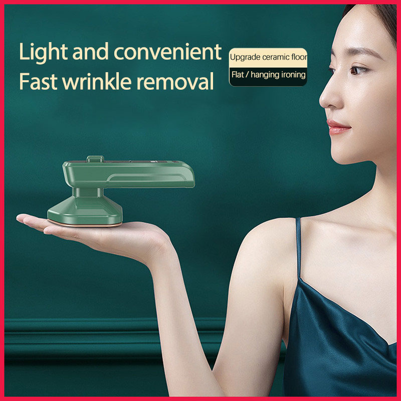 Close-up of handheld garment steamer nozzle releasing steam