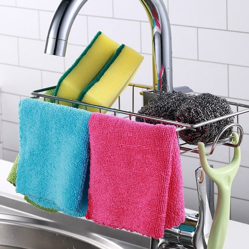 Stainless steel sink sponge holder showing drainage holes