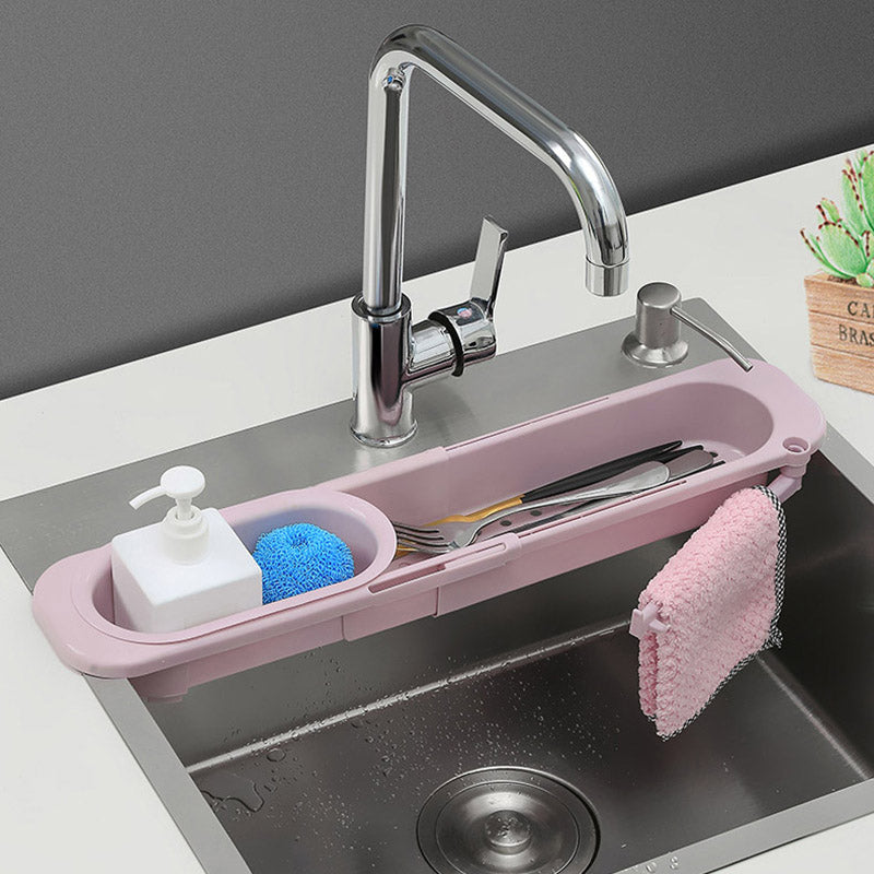 Blue sink rack with white sponge and brush