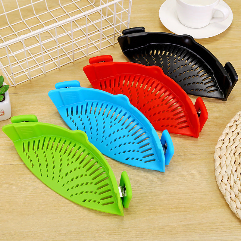 Pot strainer shown with kitchen cookware