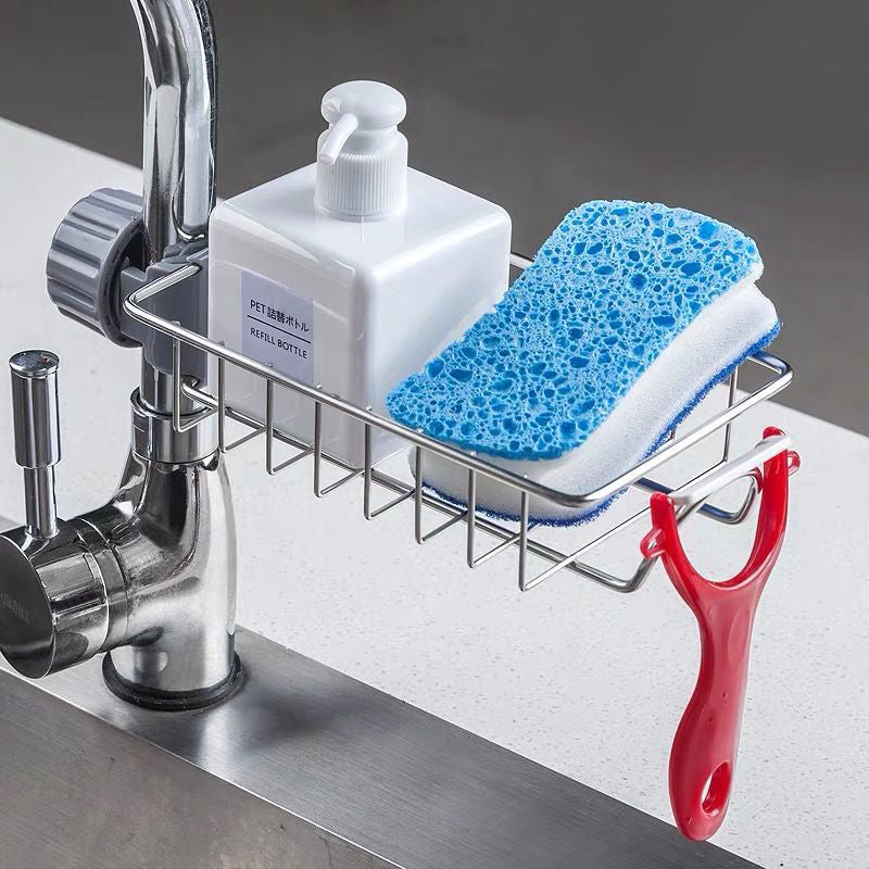 Stainless steel sink sponge holder clipped to a faucet with sponge