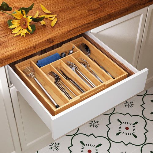 Bamboo drawer organizer with 5+2 compartments viewed from the side with contents