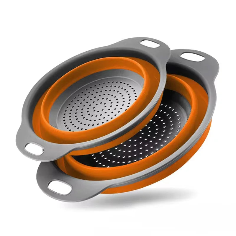 Collapsible colander with orange interior and gray exterior on a white background