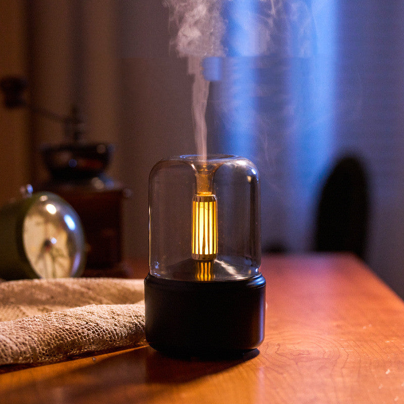 Beige aroma diffuser with flickering light on a dark background