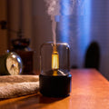 Beige aroma diffuser with flickering light on a dark background