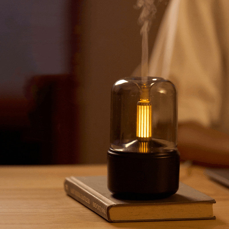Aroma diffuser with a warm flickering light