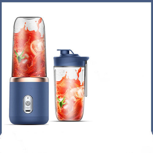 Pink portable blender with white lid and dark blue lid beside it, alternate view